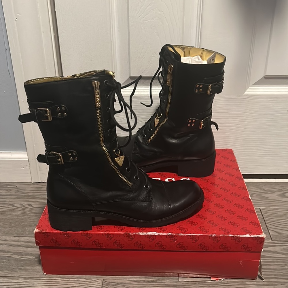 Black leather boots made by Guess